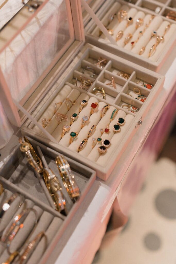 A close-up view of a jewelry box showcasing a variety of elegant rings and bangles in a sophisticated setting.